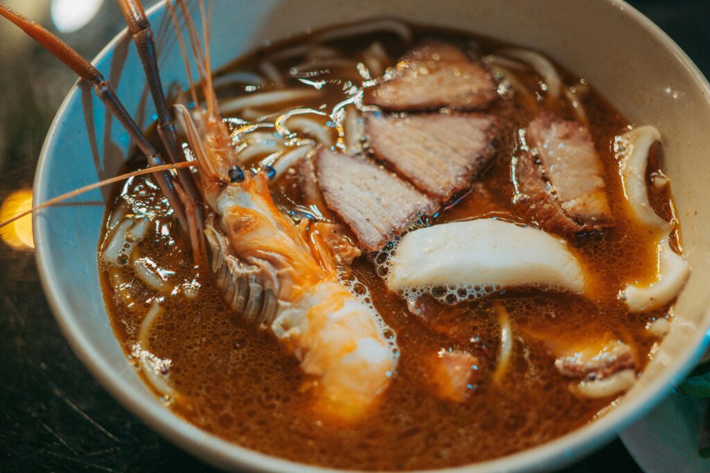 Mouthwatering seafood ramen with shrimp, pork, and noodles in a rich broth.