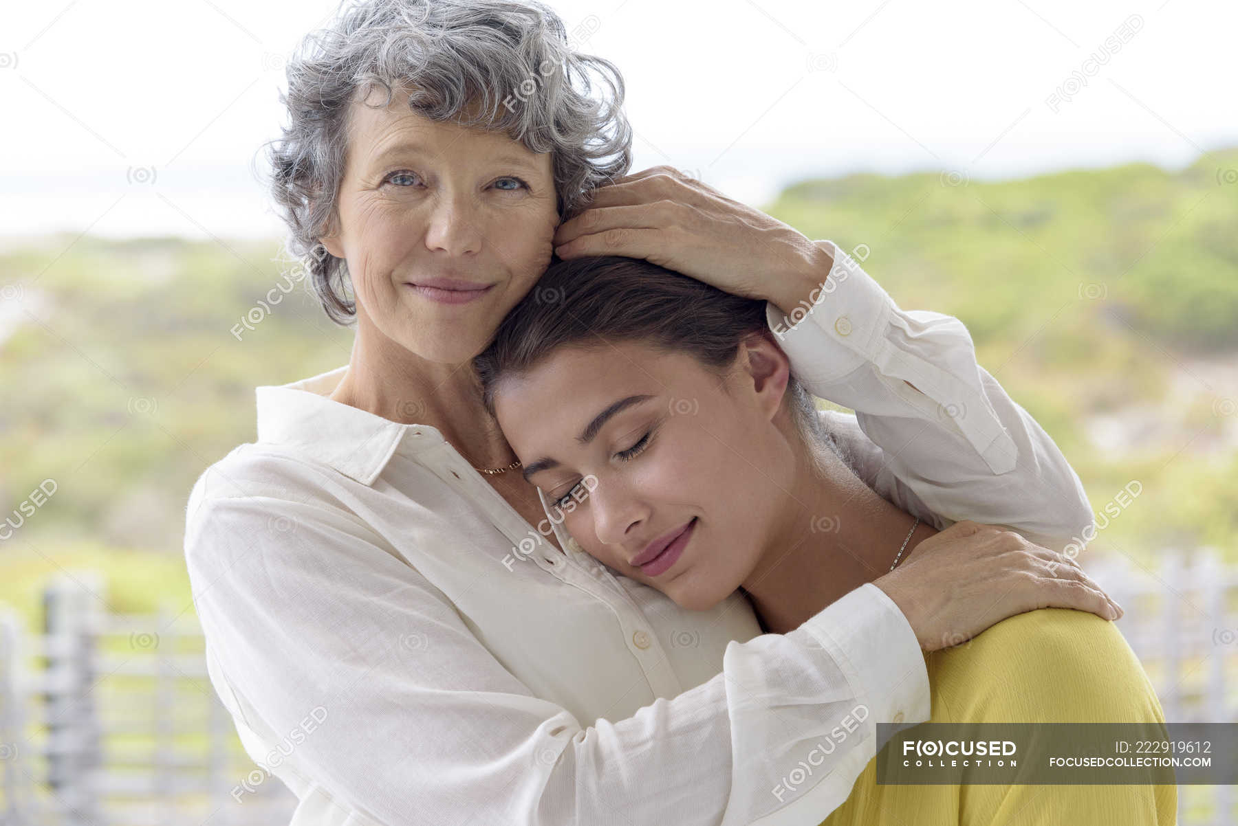 https://st.focusedcollection.com/19002158/i/1800/focused_222919612-stock-photo-loving-mother-hugging-adult-daughter.jpg